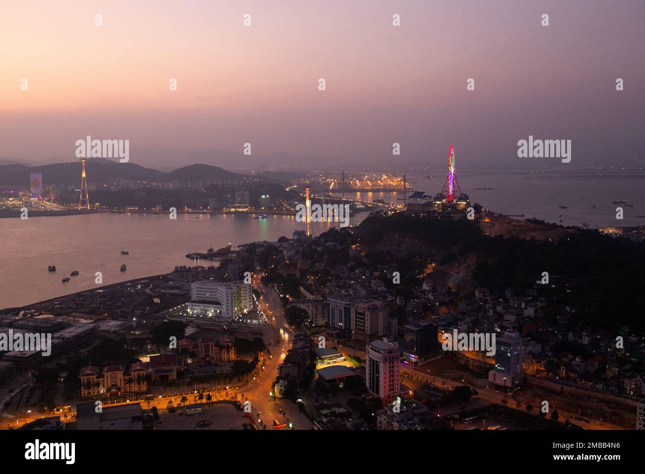 Ha Long Bay ( Halong bay ) View Over Ha Long City  - colorful city lights during a nice evening . Ha Long City , Vietnam Stock Photo