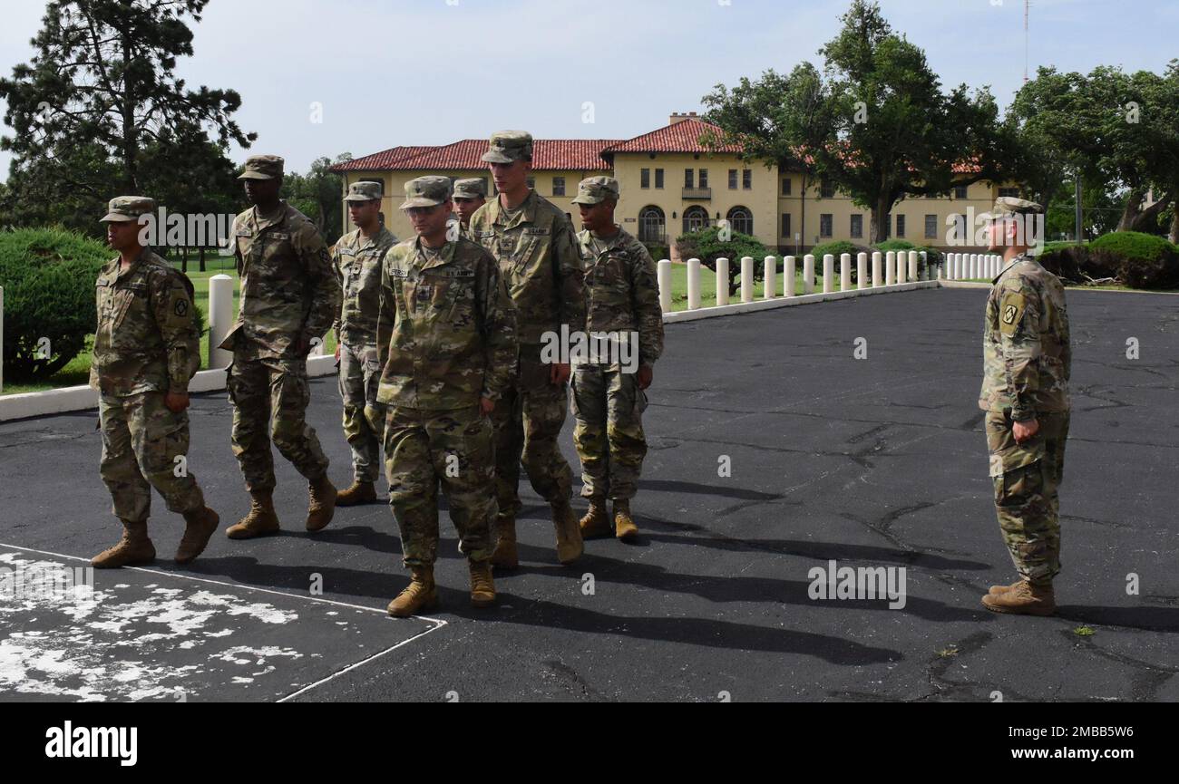 Staff Sgt. Ryan McCauley directs troop movement to begin the ceremony.  Pictured is Spc. Tyrique Gordon, Spc. Luis Perez, Pfc. Alberto Campos, Spc. Marcus Jefferson, Pfc. Moises Sabino, Sgt. Brady Block and Pvt. Gregory Hooker at McNair Hall, Fort Sill Oklahoma June 14, 2022. Stock Photo