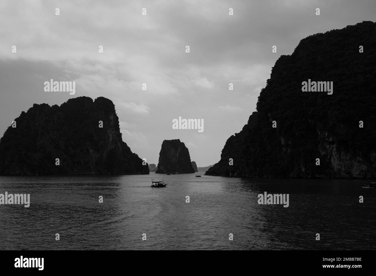 Ha Long Bay ( Halong bay ) View Over Landscape - boats float through the impressive landscape . Ha Long Bay , Vietnam Stock Photo