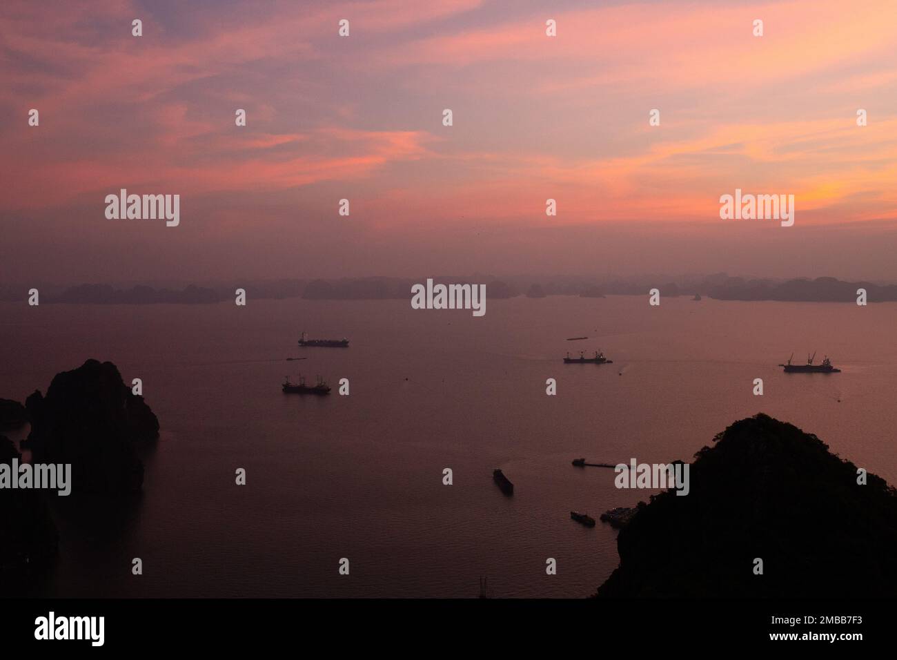 Ha Long Bay ( Halong bay ) View Over Landscape - boats float through the impressive landscape . Ha Long Bay , Vietnam Stock Photo