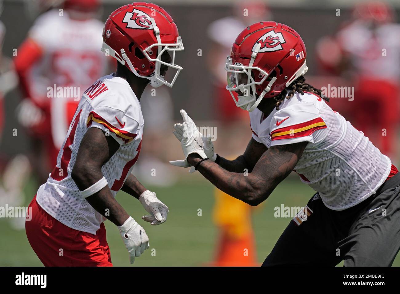 Kansas City Chiefs safety Nazeeh Johnson, left, and corner back