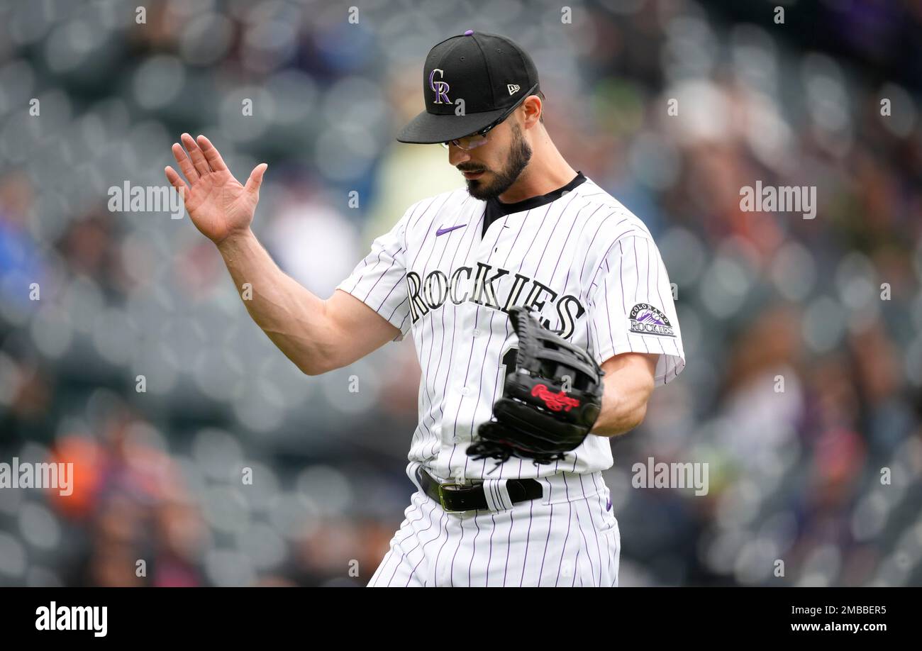 Colorado Rockies outfielder Randal Grichuk reacts after pitching during the  ninth inning of the first baseball game of the team's doubleheader against  the Miami Marlins on Wednesday, June 1, 2022, in Denver.