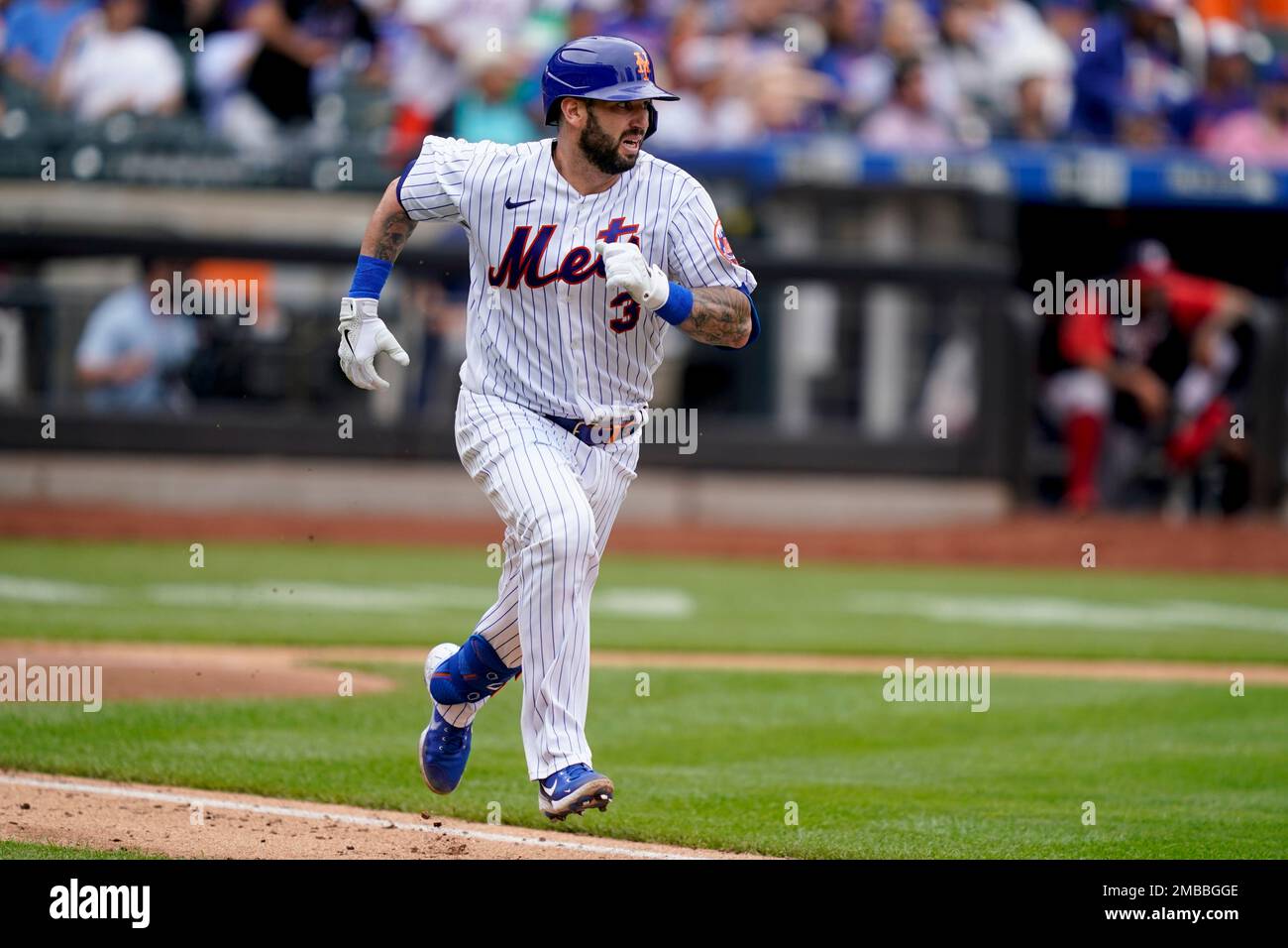 New York Mets' Tomas Nido runs up the first base line after hitting a  two-run double off Washington Nationals starting pitcher Evan Lee (59) in  the fourth inning of a baseball game