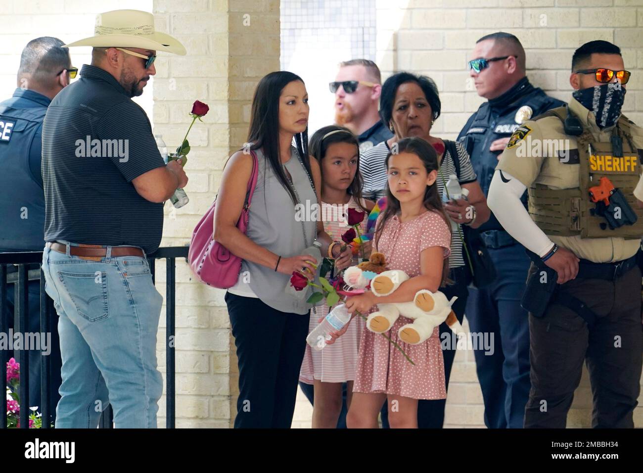 Guests leave Sacred Heart Catholic Church following the joint funeral