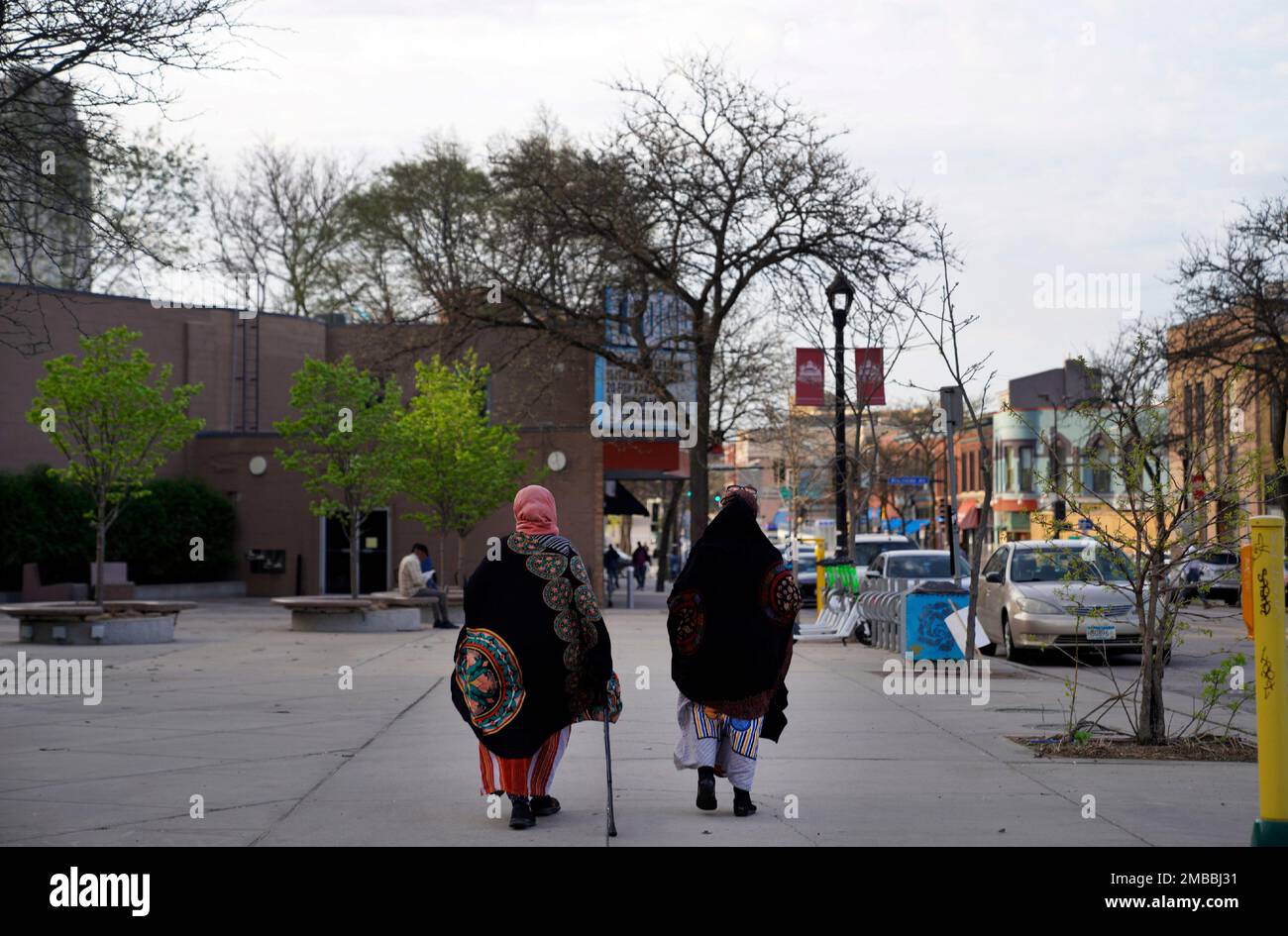 Women walk down a street in the predominantly Somali neighborhood of