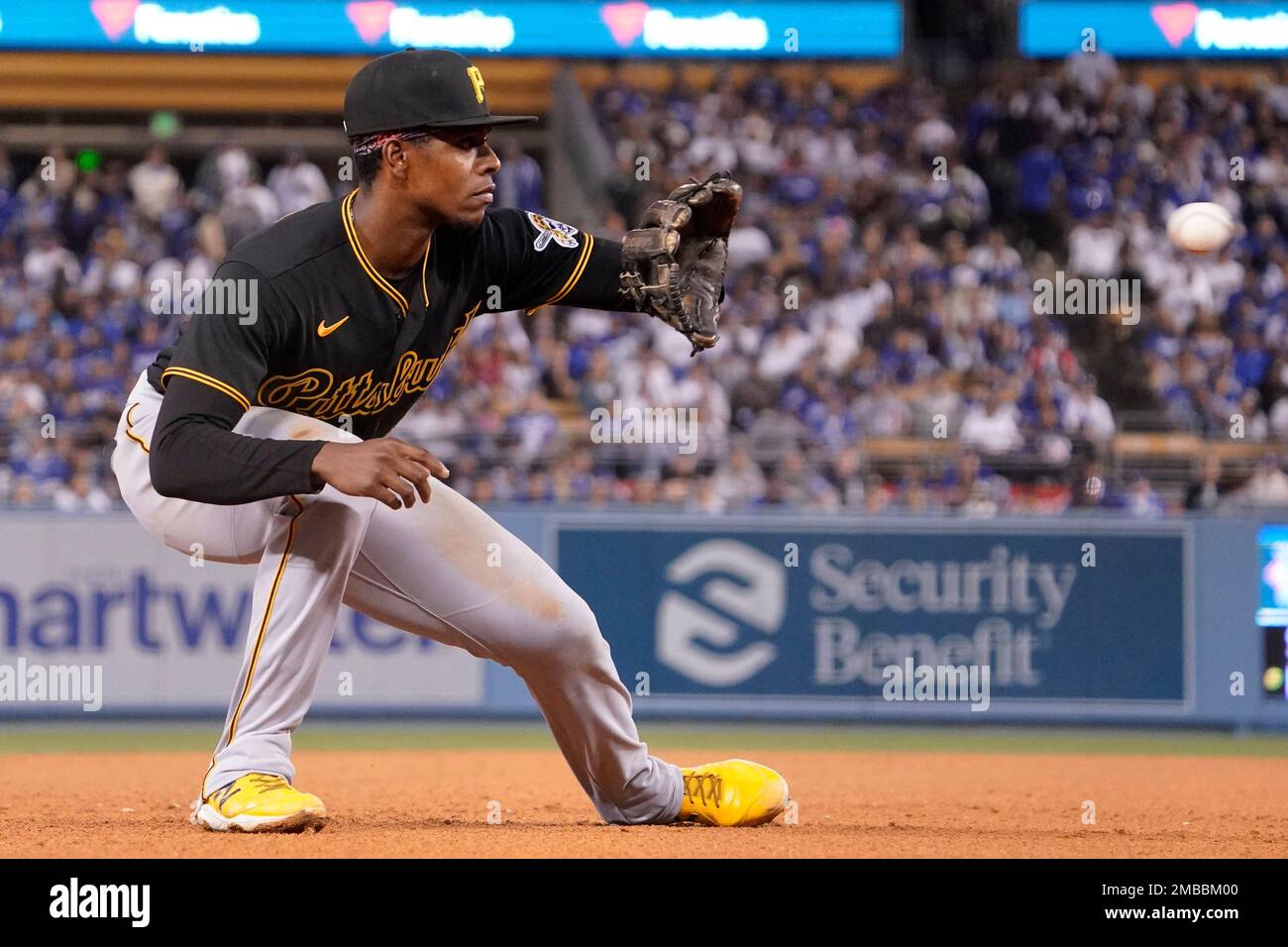 Pittsburgh Pirates third baseman Ke'Bryan Hayes fields a ball hit by Los  Angeles Dodgers' Justin Turner before throwing him out at first during the  third inning of a baseball game Tuesday, May