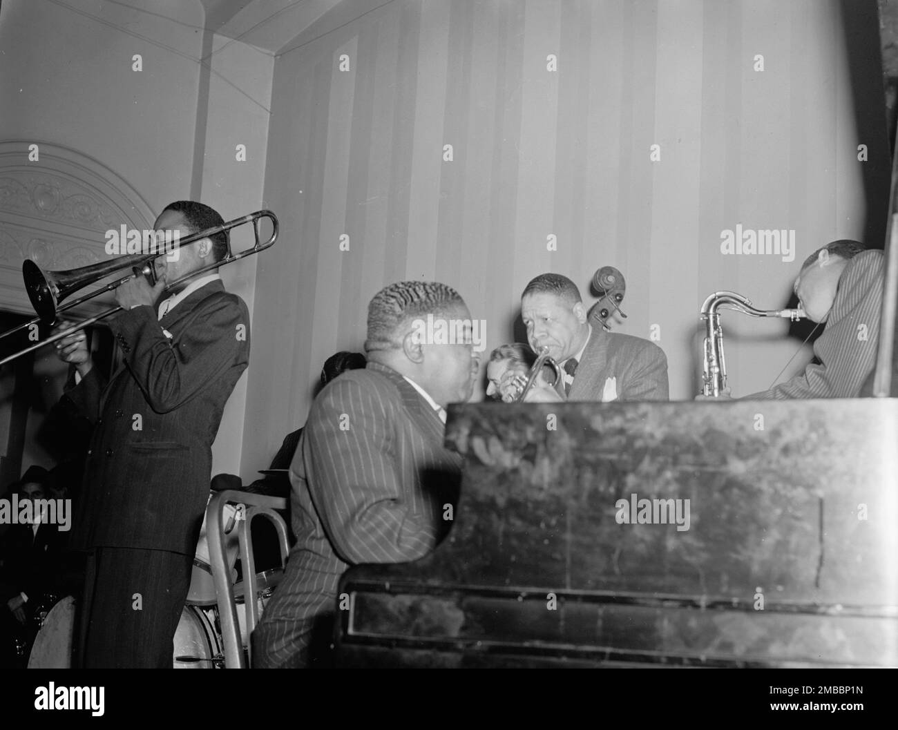 Portrait of Jay Higginbotham, Pete Johnson, Henry Allen, and Lester Young, National Press Club, Washington, D.C., ca. 1940. Stock Photo