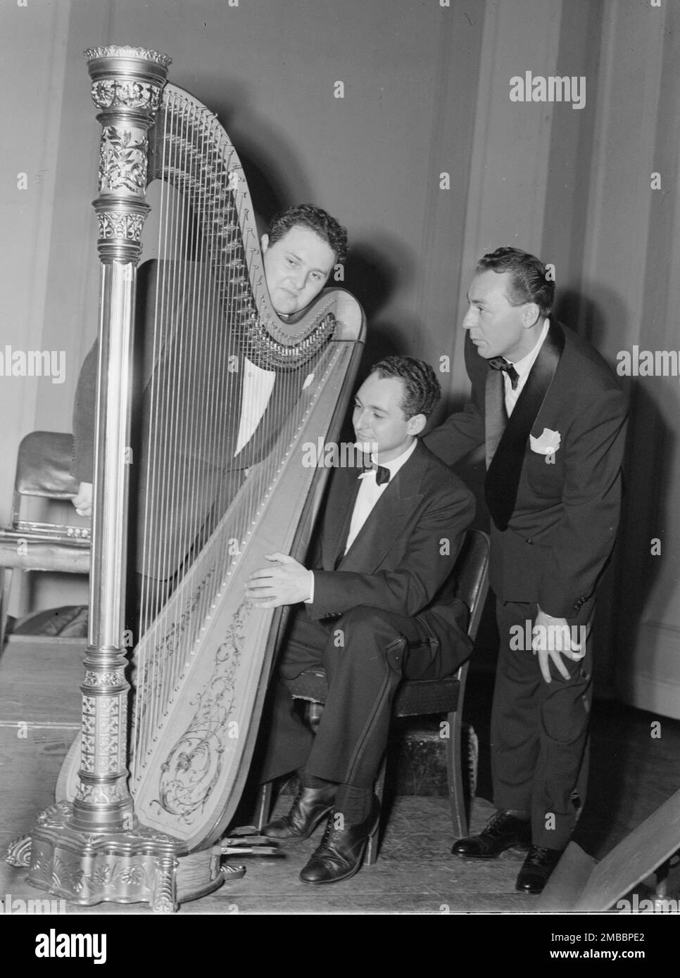 Portrait of Woody Herman, Chubby Jackson, and Abraham Rosen, Carnegie Hall(?), New York, N.Y., ca. Apr. 1946. Stock Photo