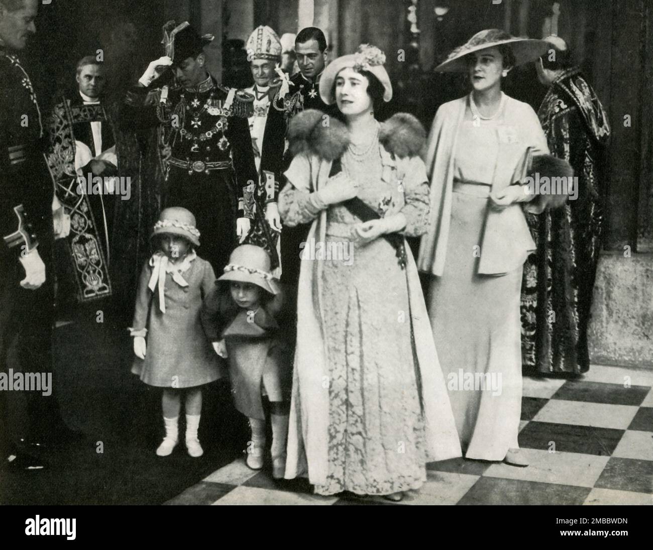 Silver Jubilee of George V and Queen Mary, 6 May 1935, (1947). Service of Thanksgiving at St Paul's Cathedral. The Duke and Duchess of York, (later King George VI and Queen Elizabeth), with Princess Elizabeth (future Queen Elizabeth II) and her younger sister Princess Margaret Rose. Also pictured are the Duke and Duchess of Kent, and the Bishop of London. From &quot;Princess Elizabeth: The Illustrated Story of Twenty-one Years in the Life of the Heir Presumptive&quot;, by Dermot Morrah. [Odhams Press Limited, London, 1947] Stock Photo