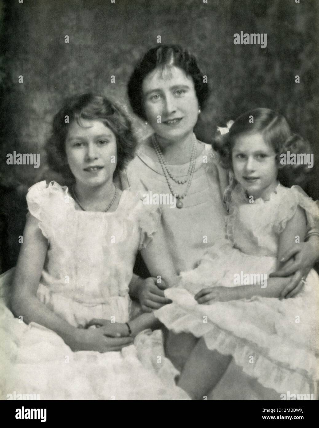 'Three Royal Ladies - 1937', 1947. The future Queen Elizabeth II with her mother Queen Elizabeth and younger sister Princess Margaret Rose. From &quot;Princess Elizabeth: The Illustrated Story of Twenty-one Years in the Life of the Heir Presumptive&quot;, by Dermot Morrah. [Odhams Press Limited, London, 1947] Stock Photo