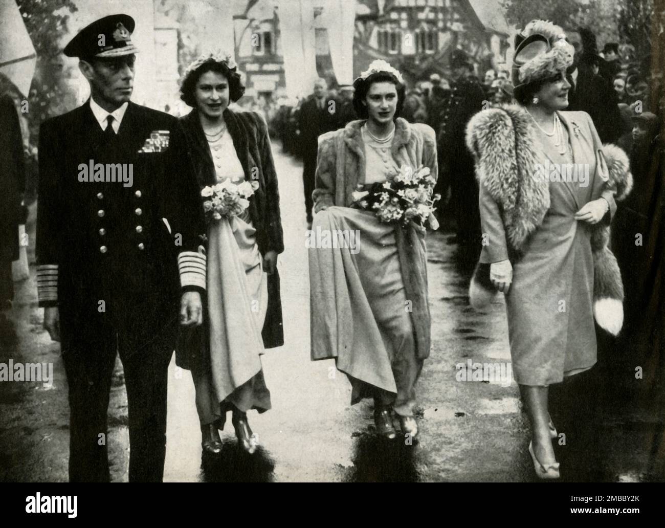 'Royal Bridesmaids', 26 October 1946, (1947). King George VI and Queen Elizabeth with daughters Princess Elizabeth (future Queen Elizabeth II) and Princess Margaret Rose at the wedding of Lady Patricia Mountbatten and Lord Brabourne at Romsey Abbey. From &quot;Princess Elizabeth: The Illustrated Story of Twenty-one Years in the Life of the Heir Presumptive&quot;, by Dermot Morrah. [Odhams Press Limited, London, 1947] Stock Photo