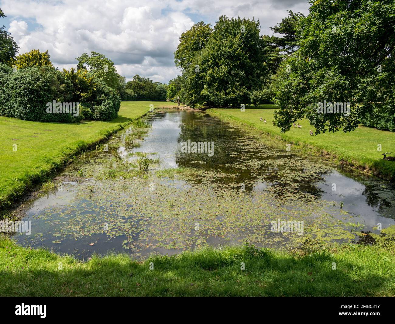 Ice Pond / Mirror Lake in Belton House Gardens, Grantham, Lincolnshire, England UK Stock Photo
