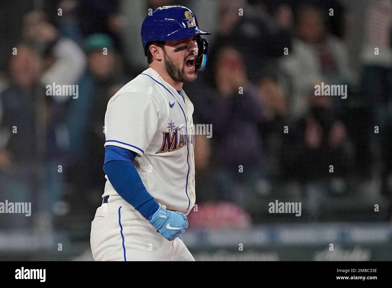 Seattle Mariners' Luis Torrens reacts after he slid safely home to score on  a RBI single hit by Ty France during the sixth inning of a baseball game  against the Houston Astros