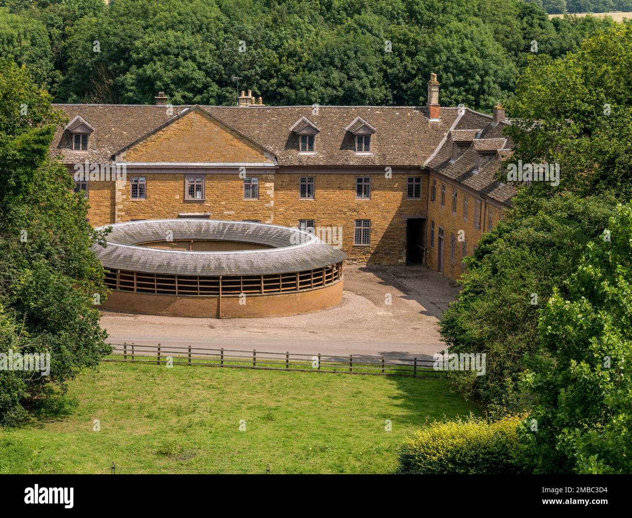 Old covered horse exercise ring in stableyard, Belvoir Castle stables, Leicestershire, England, UK Stock Photo