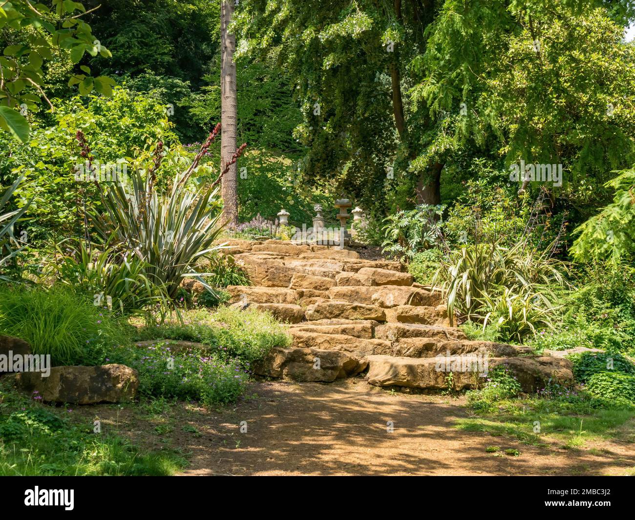 Rustic stone garden staircase steps, Belvoir Castle Gardens, Leicestershire, England, UK Stock Photo