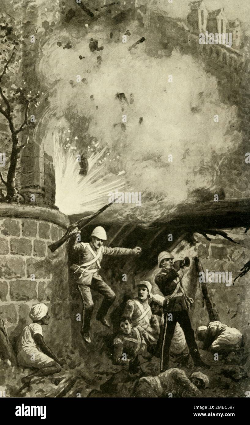 'Blowing Up the Cashmere Gate', (1902). Scene from the Great Sepoy Rebellion (also known as the Indian Mutiny), 14 September 1857. The blowing up of the Cashmere Gate enabled British soldiers to pass into the city of Delhi. From &quot;King Edward's Realm; Story of the Making of the Empire&quot;, by the Rev. C. S. Dawe, B.A. [The Educational Supply Association, Limited, Holborn Viaduct, London, 1902] Stock Photo