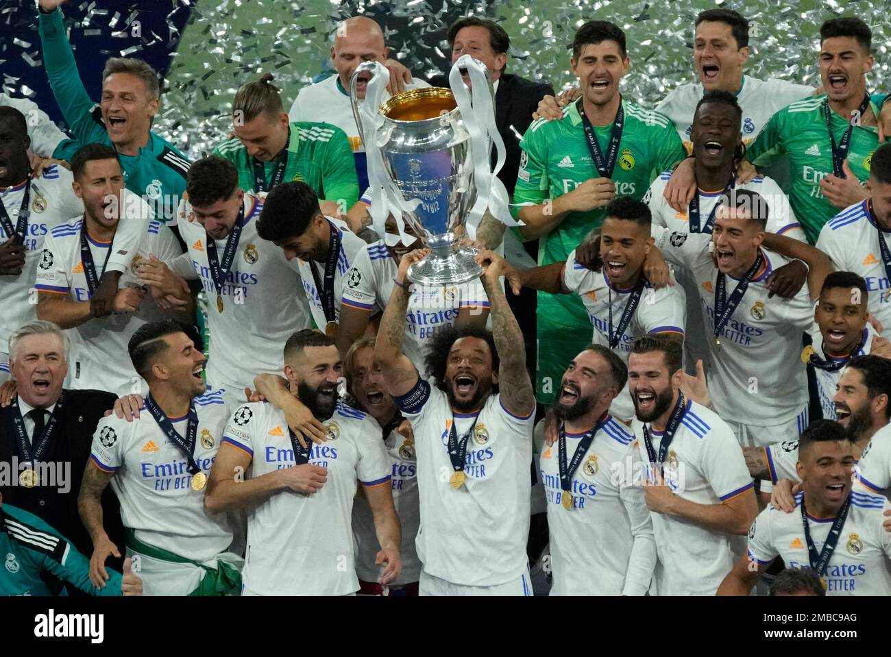 Real Madrid players hold the trophy and celebrate after winning the ...