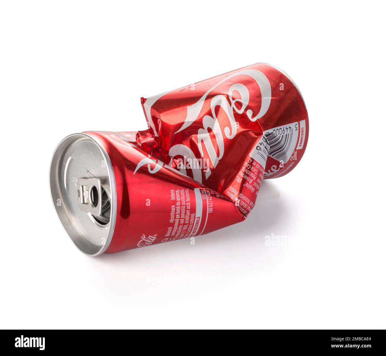 Chisinau, Moldova August 26, 2016: An Empty Dented and Crushed Can of Coca-Cola on a white background Stock Photo