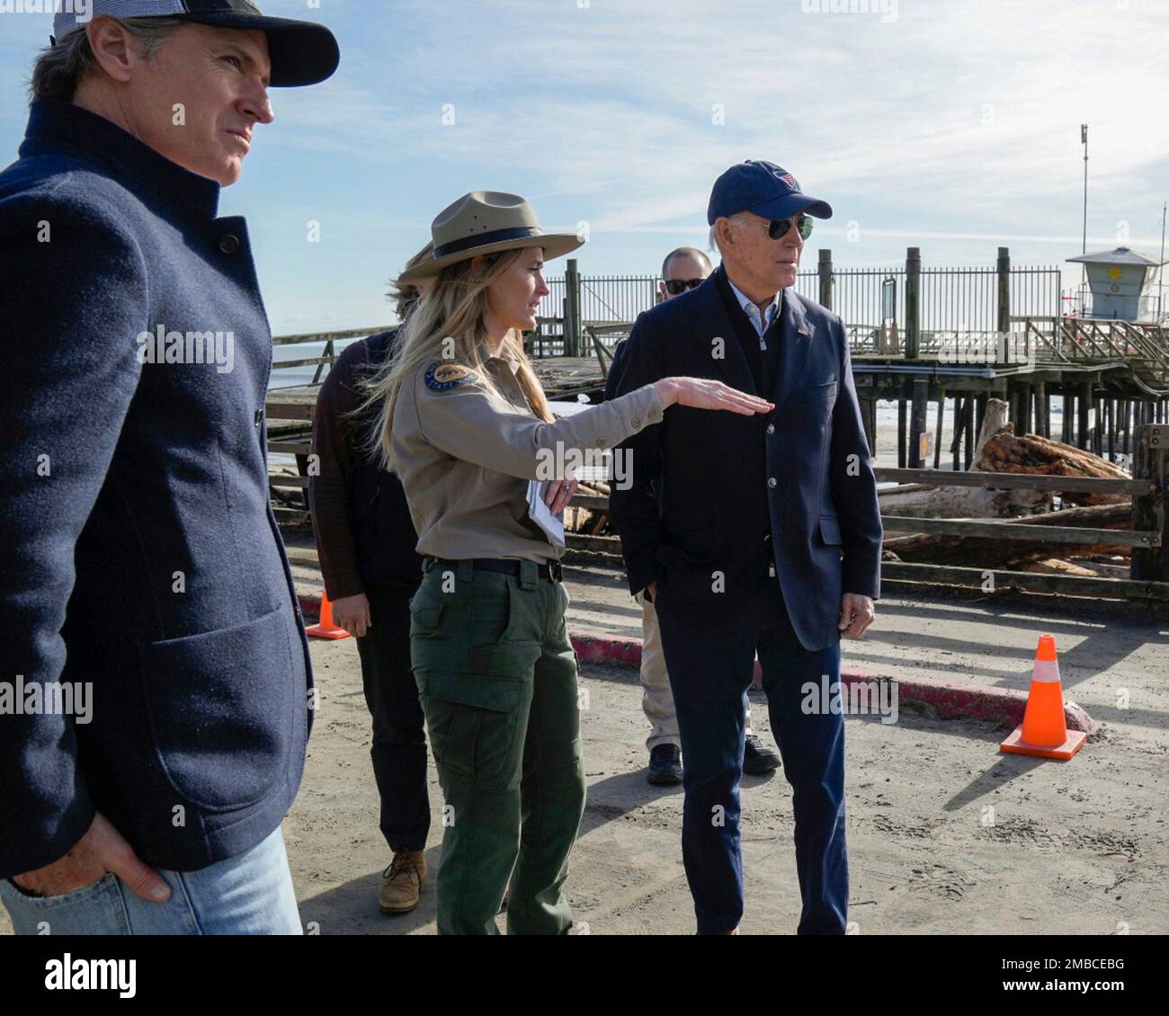 Aptos, United States Of America. 19th Jan, 2023. Aptos, United States of America. 19 January, 2023. U.S President Joe Biden, right, listens to a park ranger during a tour of areas damaged by freak rain storms with California Gov. Gavin Newsom, left, at Seacliff State Park, January 19, 2023 in Aptos, California. Credit: Adam Schultz/White House Photo/Alamy Live News Stock Photo