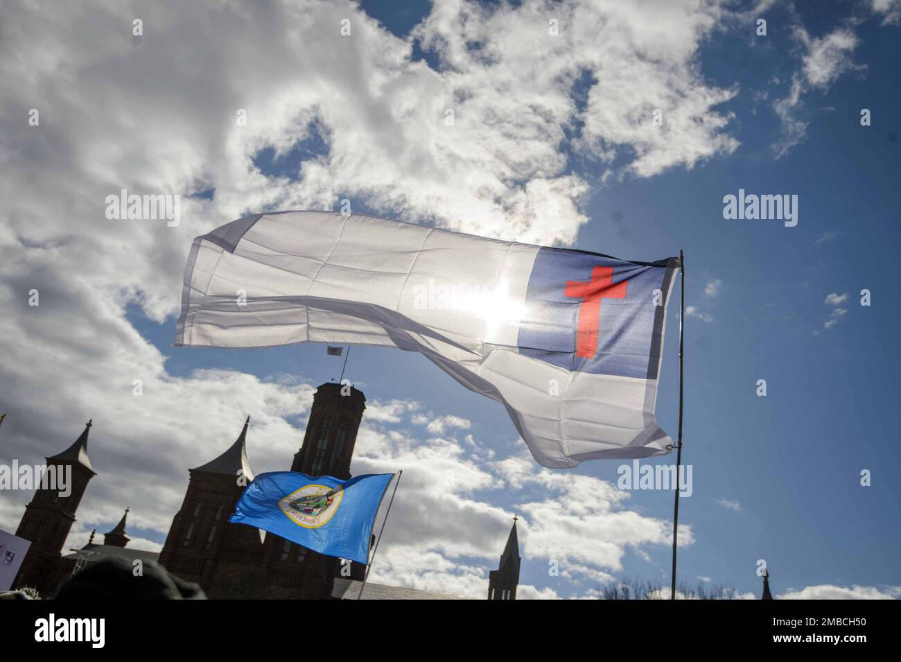 Washington DC, USA. 20th Jan, 2023. A man waves the Christian Flag during the 50th March For Life Rally on the National Mall in Washington, DC on Friday, January 20, 2023. Photo by Bonnie Cash/UPI Credit: UPI/Alamy Live News Stock Photo