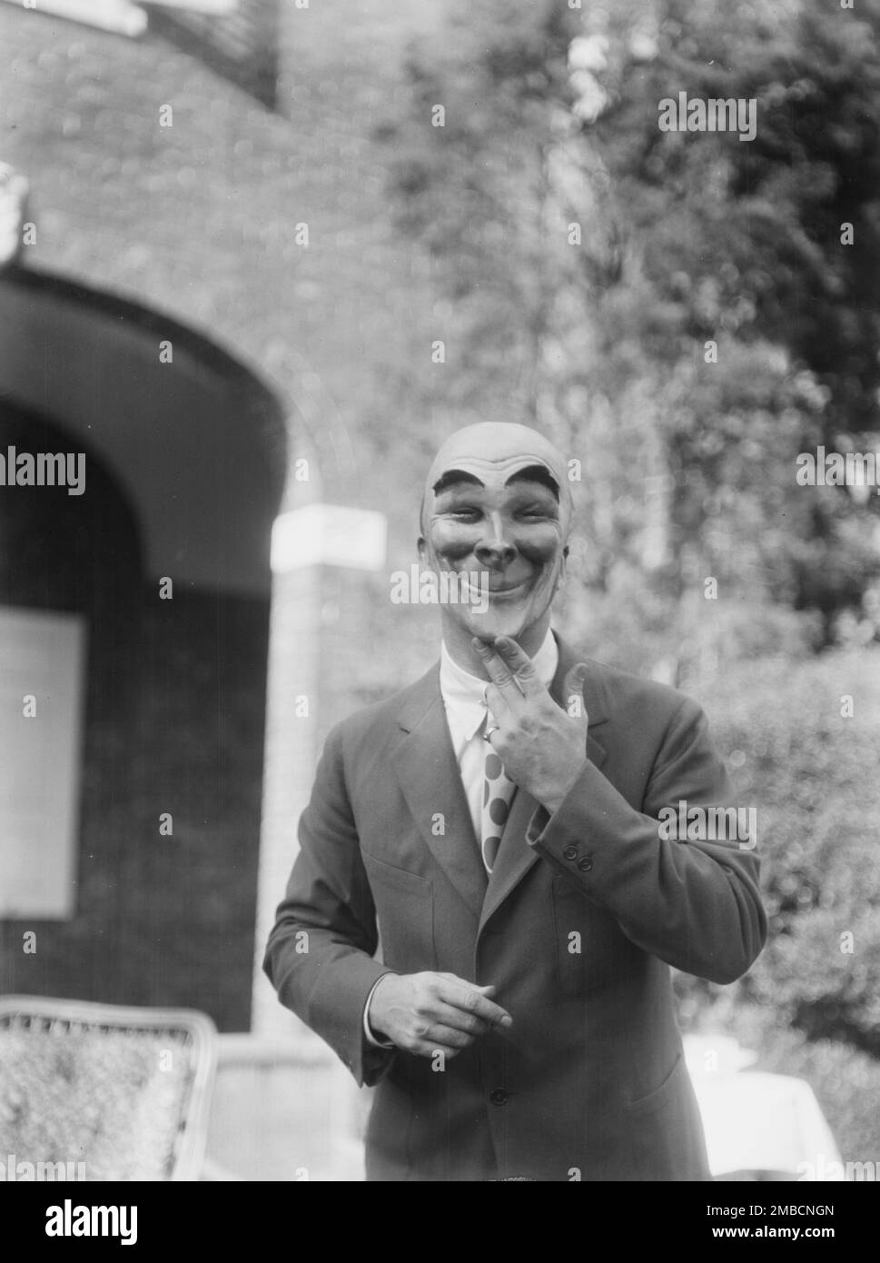 Person wearing a mask made by W.T. Benda, 1925 Sept. 20. Stock Photo