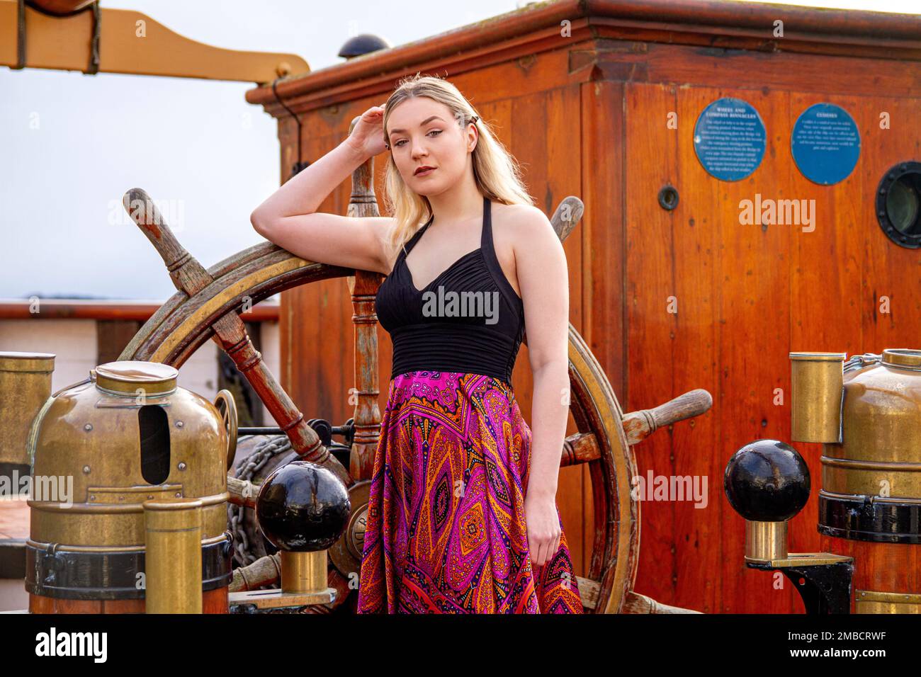 Hayleigh Young, a beautiful and fashionable woman poses for photograph on board the RRS Discovery ship on an icy cold winters day in Dundee, Scotland Stock Photo