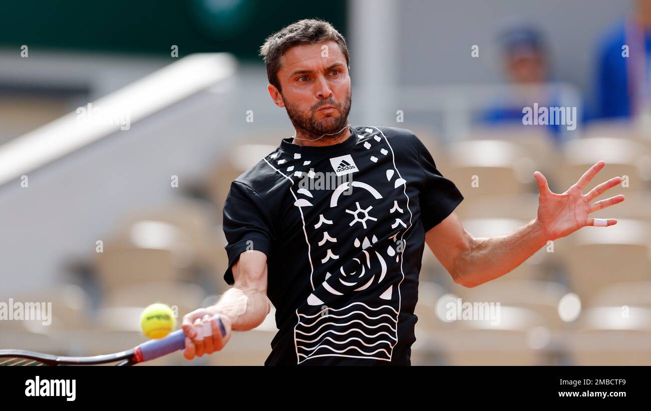 France's Gilles Simon plays a shot against Steve Johnson of the U.S. during  their second round match at the French Open tennis tournament in Roland  Garros stadium in Paris, France, Thursday, May