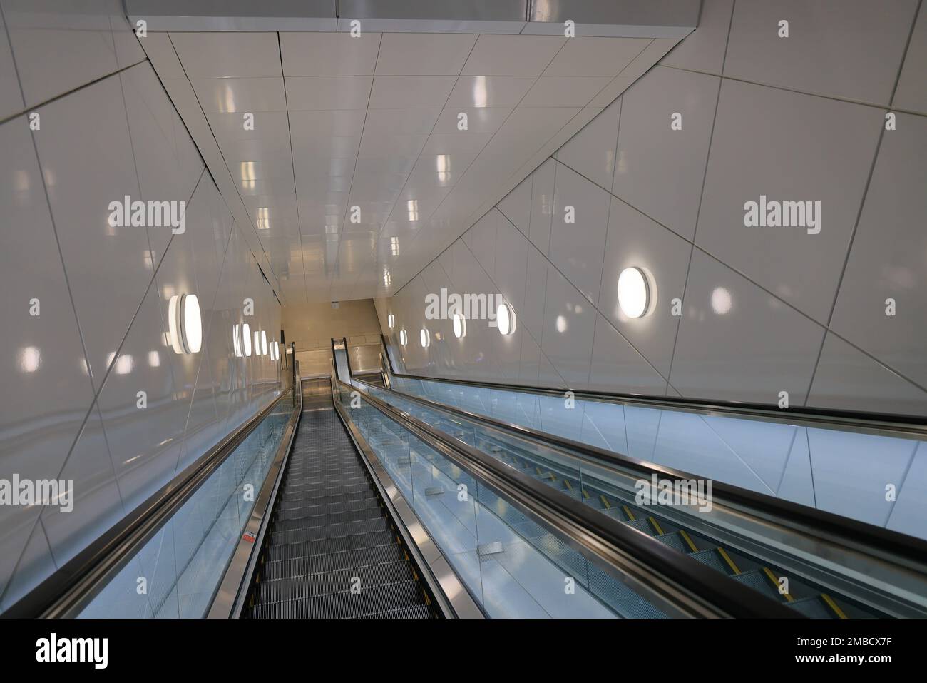 Escalator in modern buildings or subway station, escalator in a shopping center. Automatic escalator in the subway. Stock Photo
