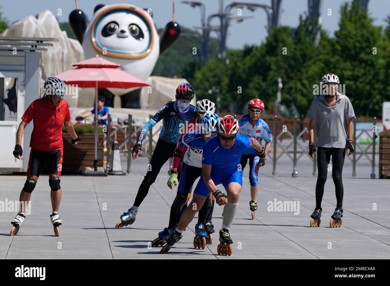 Residents rollerblade in a group on Olympic Green on Thursday, May 26,  2022, in Beijing. (AP Photo/Ng Han Guan Stock Photo - Alamy