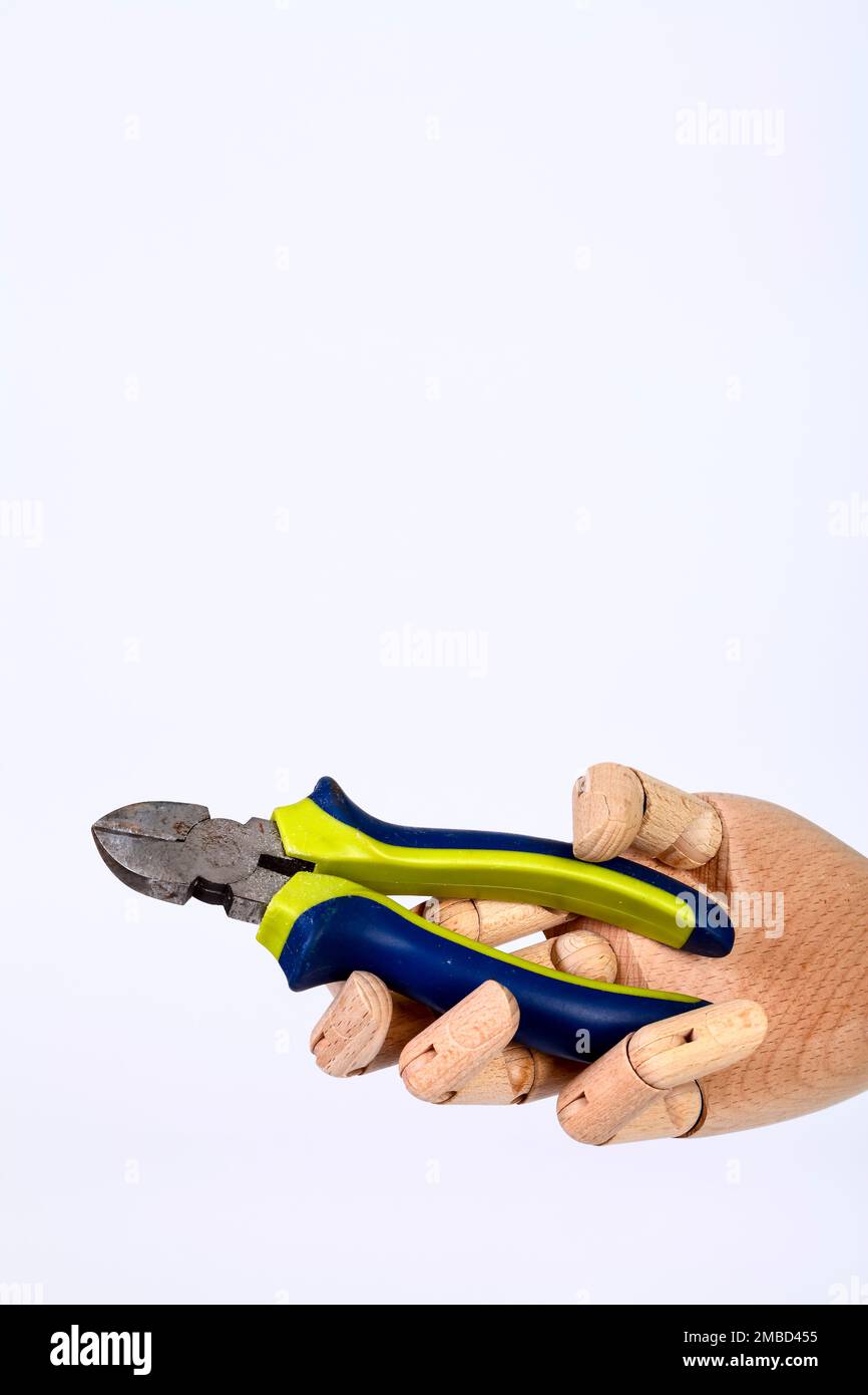 Wooden hand holding side cutters hand tool isolated on a white
