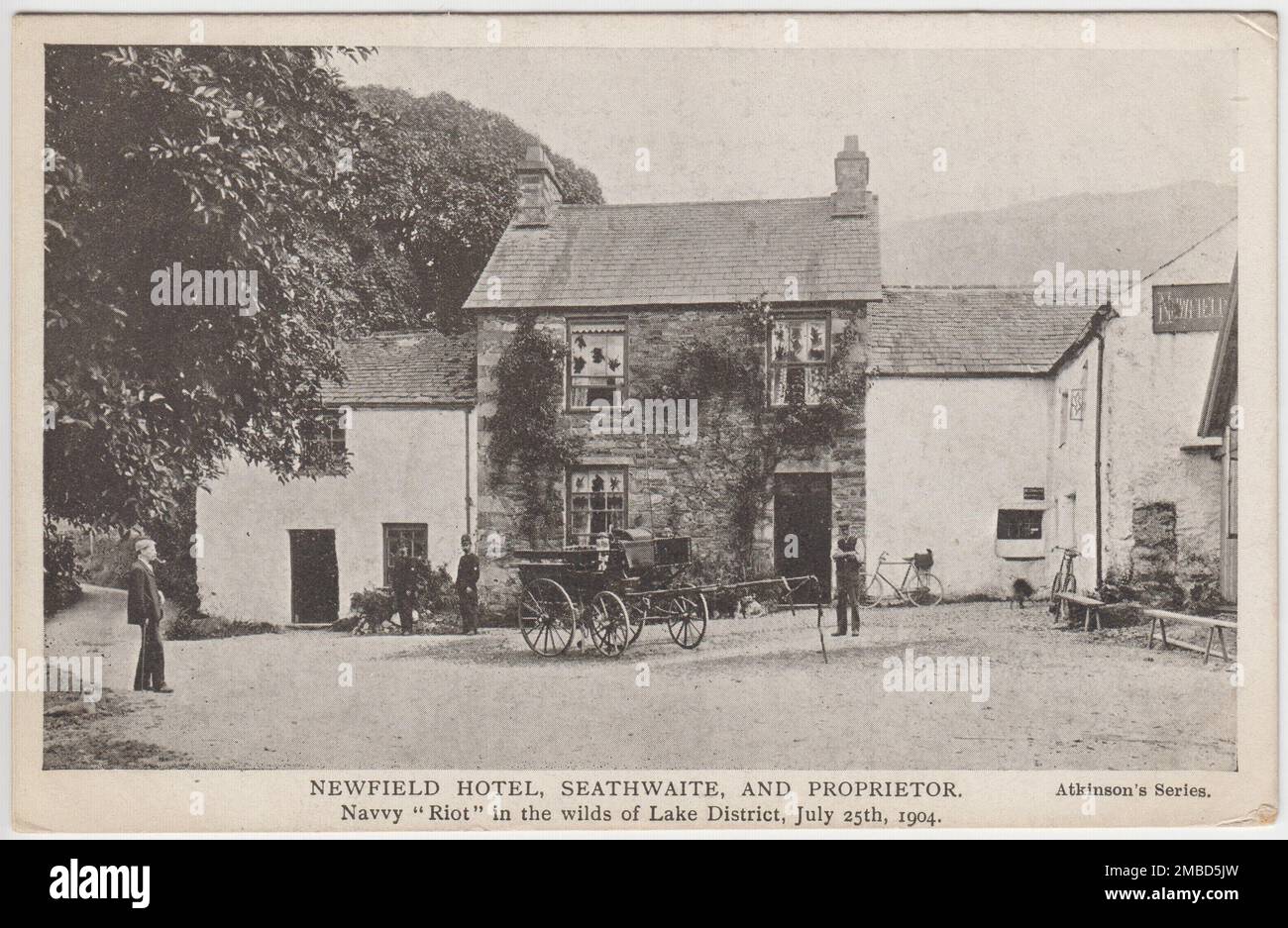 'Newfield Hotel, Seathwaite, and proprietor: Navvy 'riot' in the wilds of Lake District, July 25th 1904': postcard showing the hotel with smashed windows and a cart outside Stock Photo