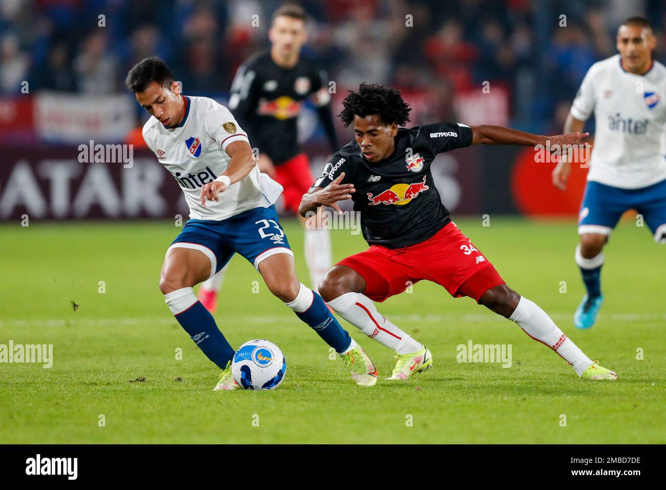 Álex Castro of Uruguay's Nacional heads the ball past Andres Hurtado of  Brazil's Red Bull Bragantino during a Copa Libertadores soccer match in  Montevideo, Uruguay, Tuesday, May 24, 2022. (AP Photo/Matilde Campodonico