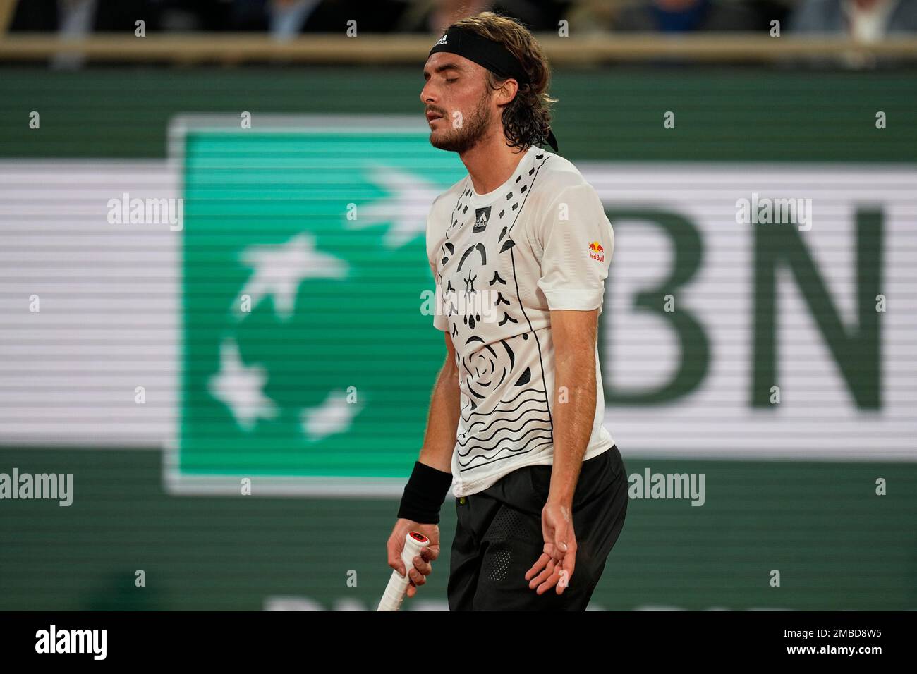 Greeces Stefanos Tsitsipas reacts as he plays Italys Lorenzo Musetti during their first round match of the French Open tennis tournament at the Roland Garros stadium Tuesday, May 24, 2022 in Paris