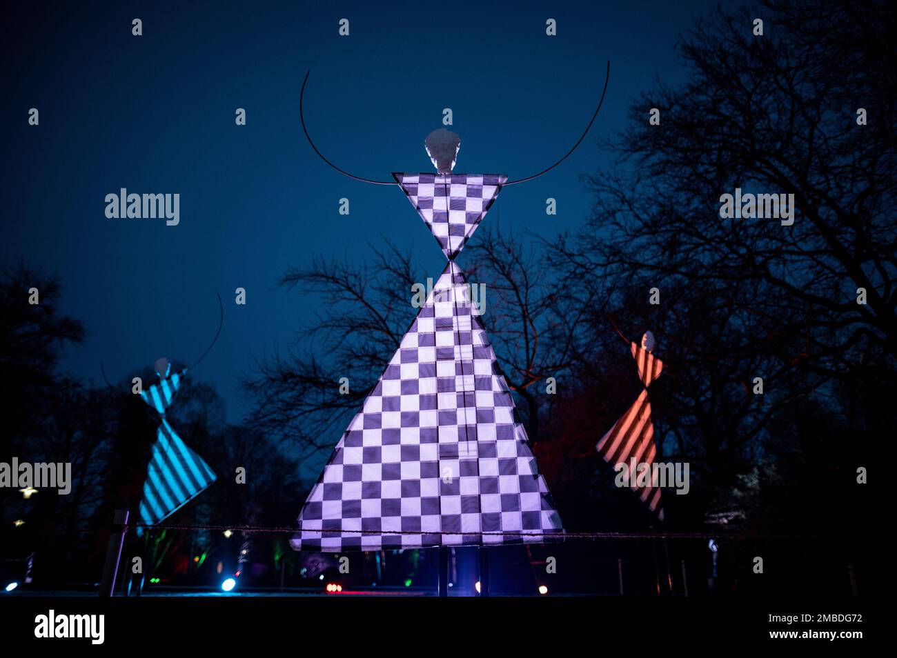 Essen, Germany. 20th Jan, 2023. Figures are illuminated in the blue hour in the Grugapark. The Grugapark in Essen will be bathed in an imaginative light in the coming weeks. From Jan. 21, 2023, until Feb. 26, 2023, the Park Lights will take place with installations by light artist Flammersfeld. With LEDs and the use of beamers, the Grugapark will become a sea of lights. Credit: Fabian Strauch/dpa/Alamy Live News Stock Photo