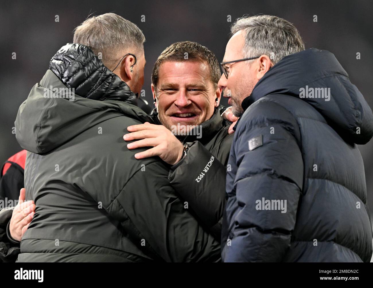 20 January 2023, Saxony, Leipzig: Soccer, Bundesliga, RB Leipzig - FC Bayern Munich, Matchday 16, Red Bull Arena. Leipzig's Managing Director Sport Max Eberl (center) welcomes Stefan Kuntz (left), coach of the Turkish national soccer team, and presenter Matthias Opdenhövel during the pre-match interview. IMPORTANT NOTE: In accordance with the regulations of the DFL Deutsche Fußball Liga and the DFB Deutscher Fußball-Bund, it is prohibited to use or have used photographs taken in the stadium and/or of the match in the form of sequence pictures and/or video-like photo series. Photo: Hendrik Schm Stock Photo