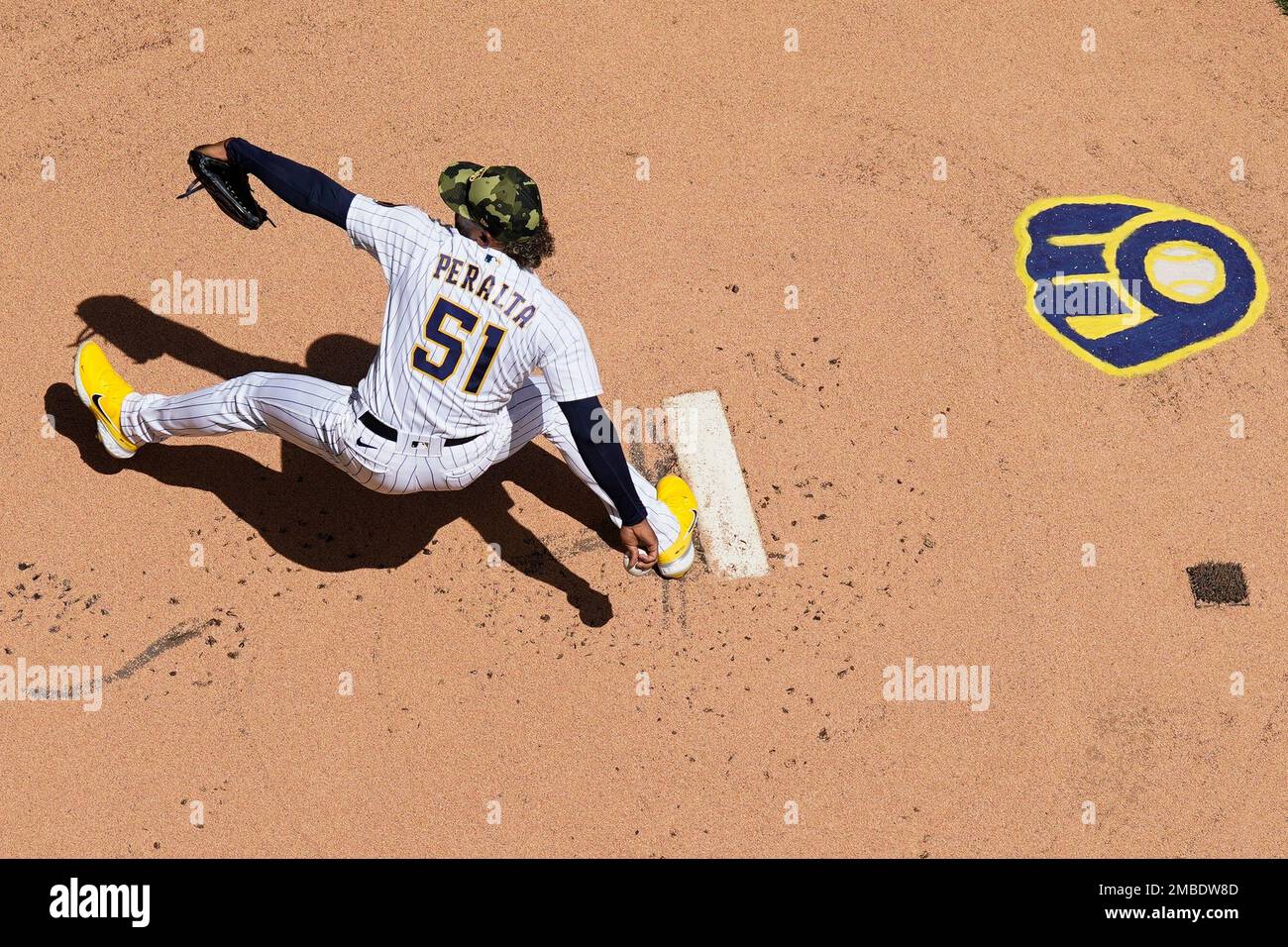 Milwaukee Brewers' Freddy Peralta throws during a spring training baseball  workout Thursday, Feb. 16, 2023, in Phoenix. (AP Photo/Morry Gash Stock  Photo - Alamy
