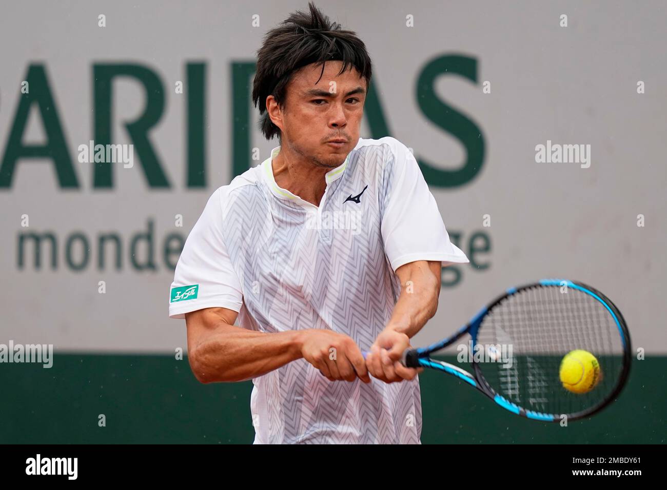 Japan's Taro Daniel plays a shot against France's Gregoire Barrere during  their first round match at the French Open tennis tournament in Roland  Garros stadium in Paris, France, Sunday, May 22, 2022. (