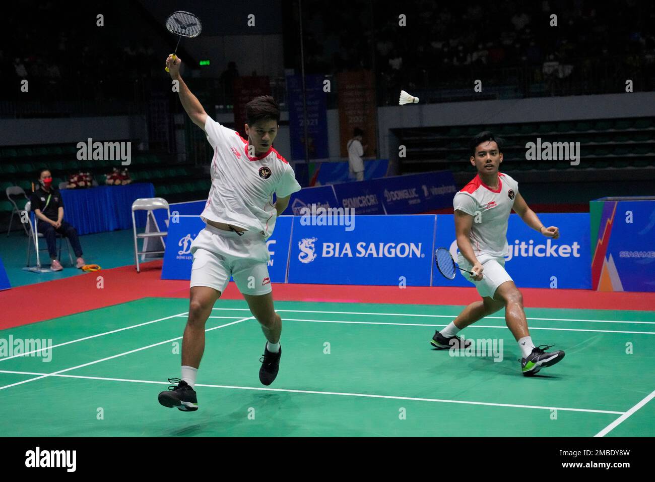 Indonesias Pramudya Kusumawardana, right, and Yeremia Rambitan compete against their compatriots Leo Rolly Carnando and Daniel Marthin during their mens doubles badminton final match at the 31st Southeast Asian Games (SEA Games)