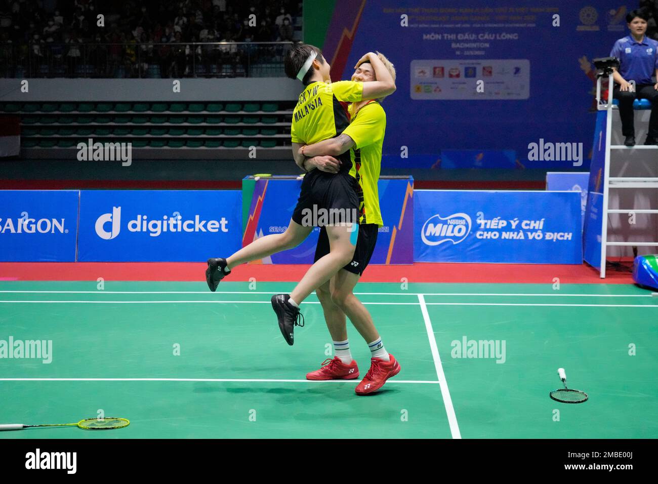 Malaysias Chen Tang Jie, right, and Peck Yen Wei celebrate after defeating their compatriots Hoo Pang Ron and Cheah Yee See during their mixed doubles badminton final match at the 31st Southeast