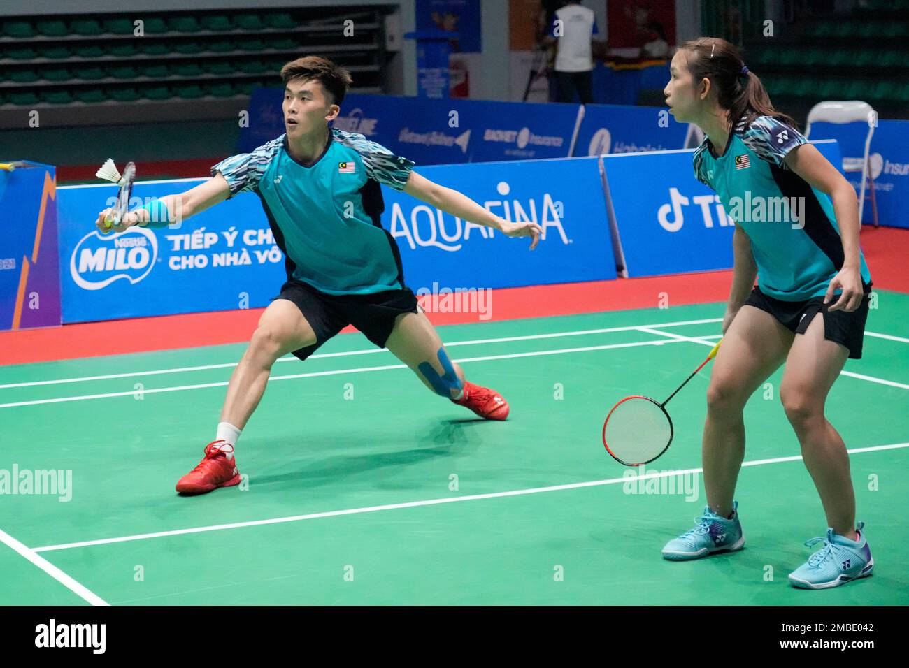 Malaysias Hoo Pang Ron, left, and Cheah Yee See compete against their compatriots Chen Tang Jie and Peck Yen Wei during their mixed doubles badminton final match at the 31st Southeast Asian