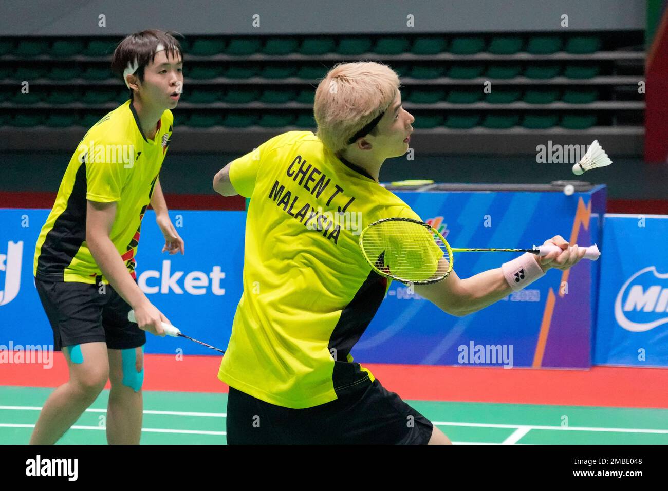 Malaysias Chen Tang Jie, right, and Peck Yen Wei compete against their compatriots Hoo Pang Ron and Cheah Yee See during their mixed doubles badminton final match at the 31st Southeast Asian