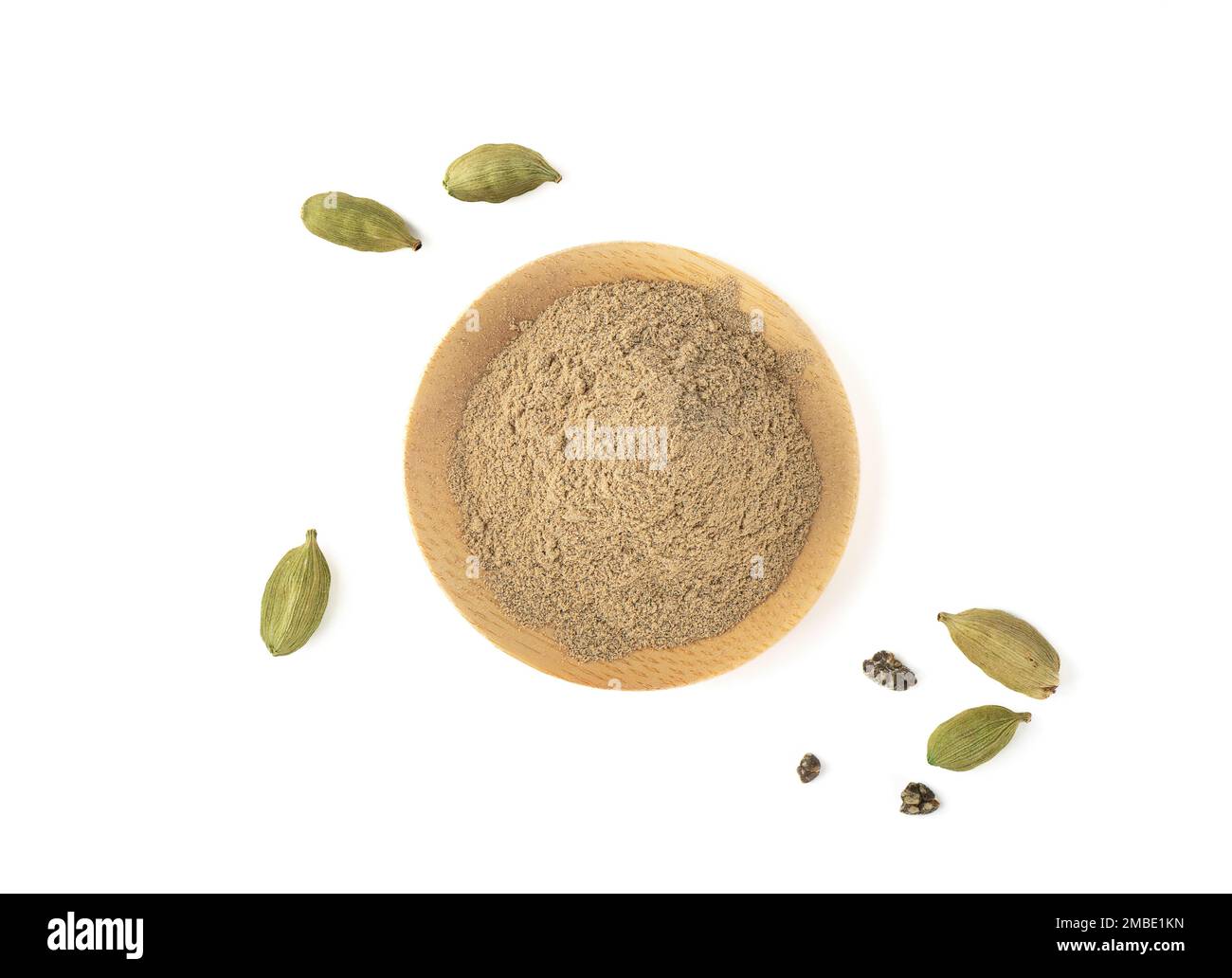 Top view of ground cardamom and cardamom pods on white background. Copy