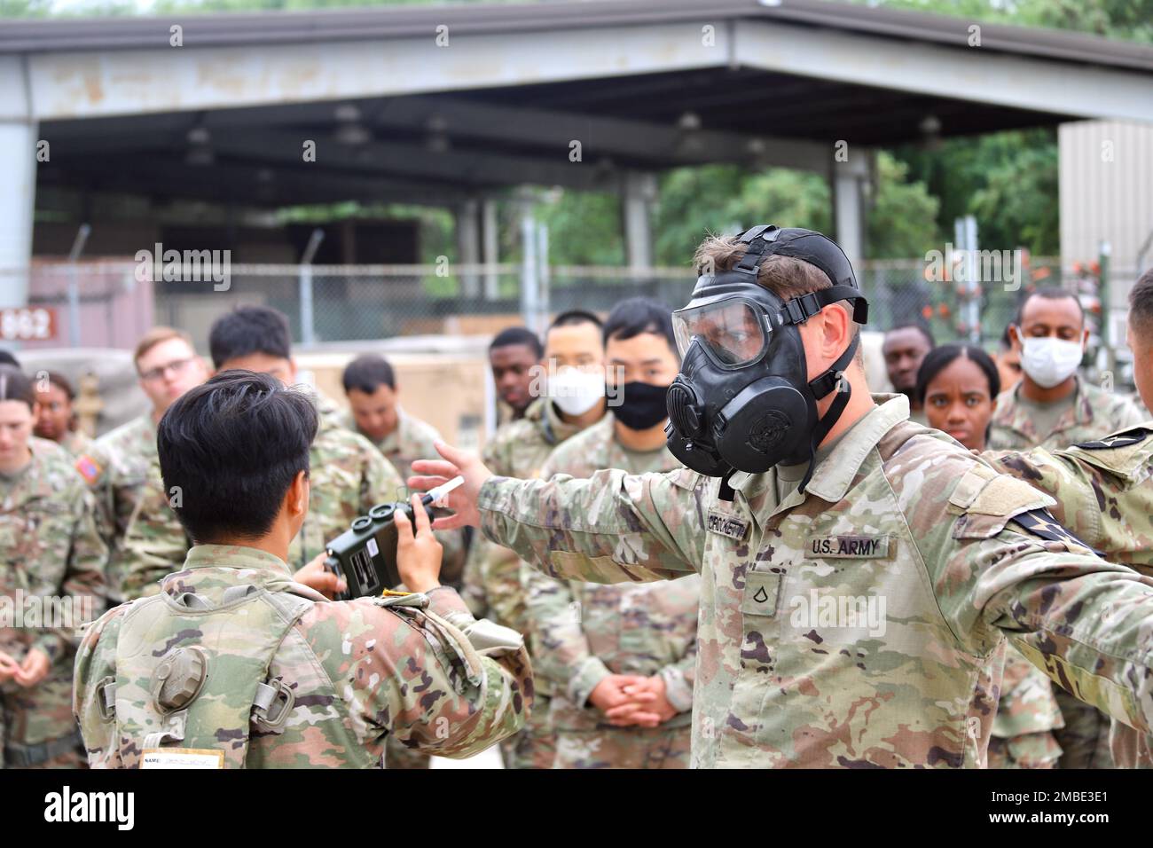 Soldiers from 23rd Chemical Battalion, 2nd Infantry Division Sustainment Brigade lead a class on decontamination of personnel affected by chemical, biological, radiological or nuclear (CBRN) contaminants. Soldiers from 4-2 Attack Battalion learned the thorough process to go through for decontamination of personnel through seven stations to carefully remove each piece of mission oriented protection posture (MOPP) protective gear. Stock Photo