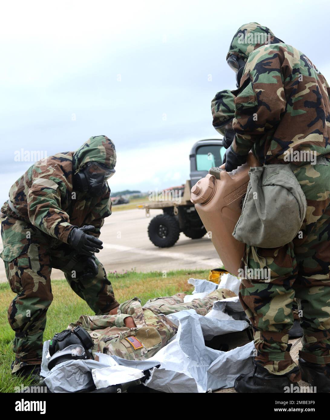 Soldiers from 23rd Chemical Battalion, 2nd Infantry Division Sustainment Brigade lead a class on decontamination of personnel affected by chemical, biological, radiological or nuclear (CBRN) contaminants. Soldiers from 4-2 Attack Battalion learned the thorough process to go through for decontamination of personnel through seven stations to carefully remove each piece of mission oriented protection posture (MOPP) protective gear. Stock Photo