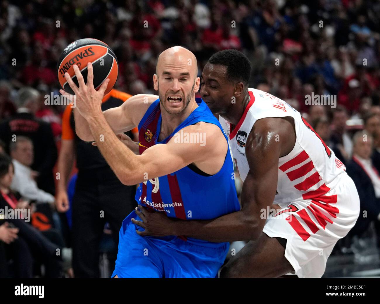 Barcelona's Nick Calathes, left,drives to the basket asOlympiakos' Livio  Jean-Charles tries to block him during their Final Four Euroleague bronze  medal basketball match between Barcelona and Olympiacos, in Belgrade,  Serbia, Saturday, May
