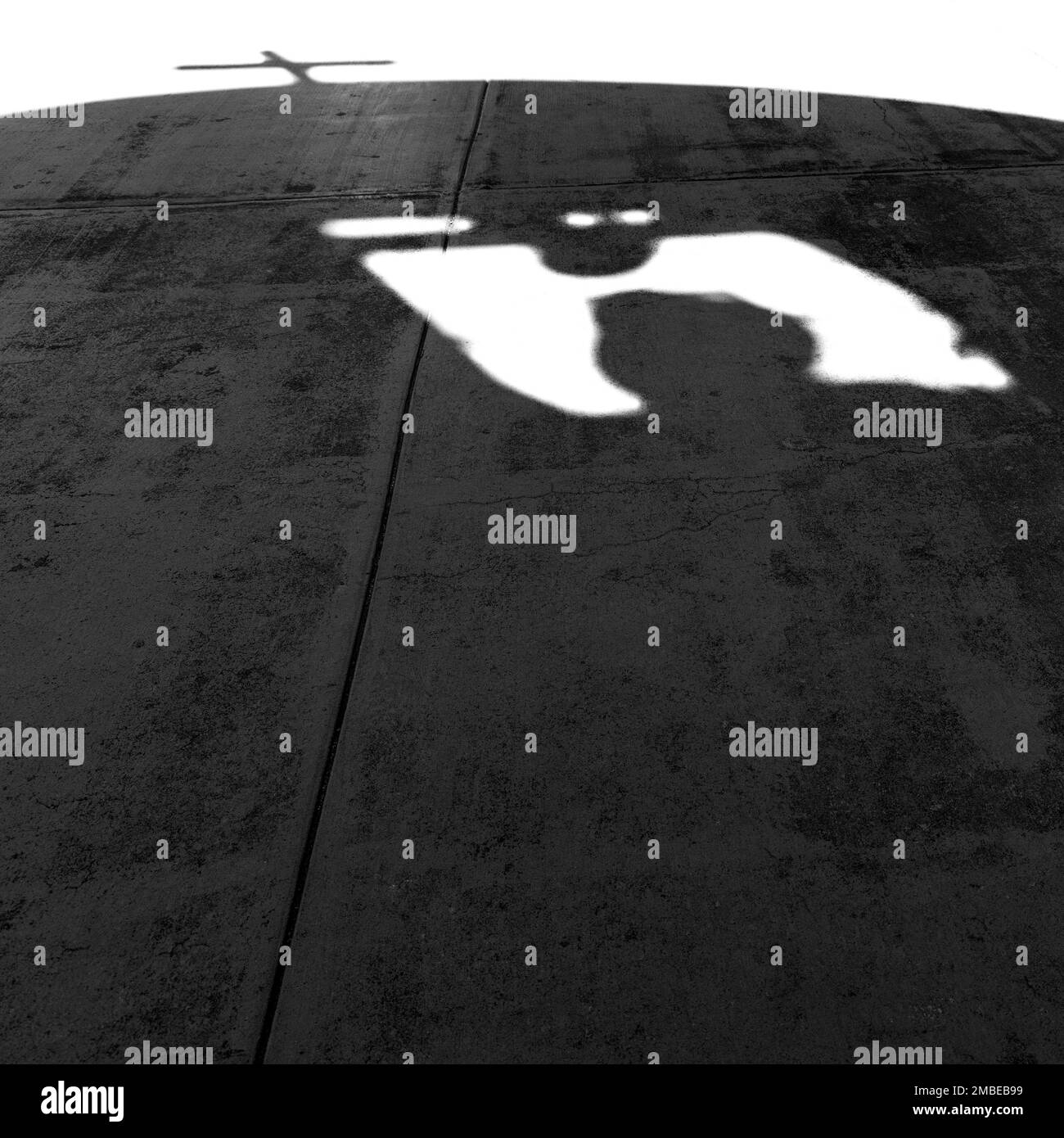 The shadow of the San Elizario Mission bell tower, on the El Paso