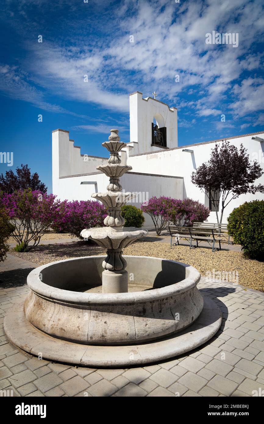 A dry fountain next to the Socorro Mission on the El Paso Mission Trail in Socorro, Texas. Stock Photo