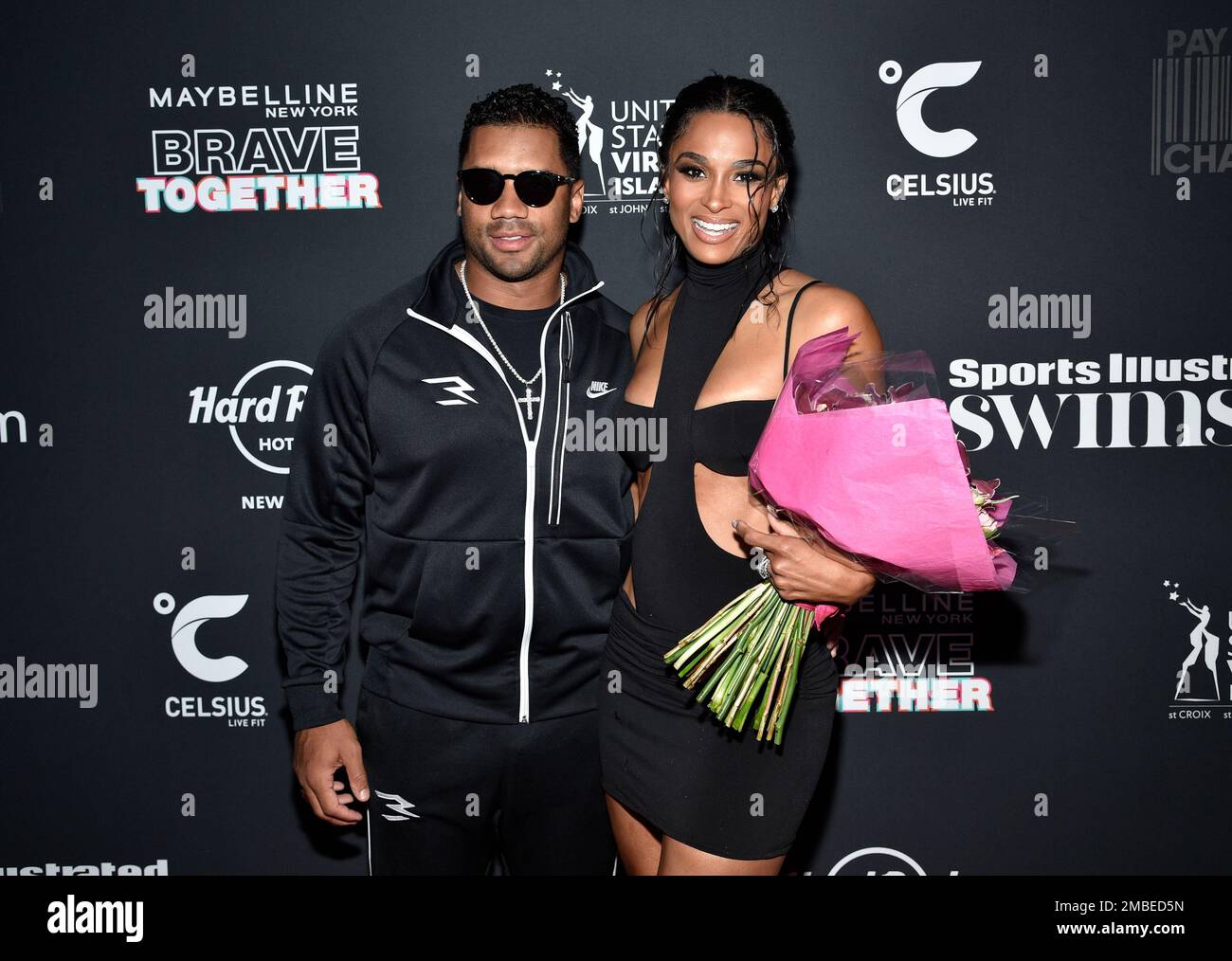 NFL quarterback Russell Wilson, left, and wife Ciara attend the Sports ...