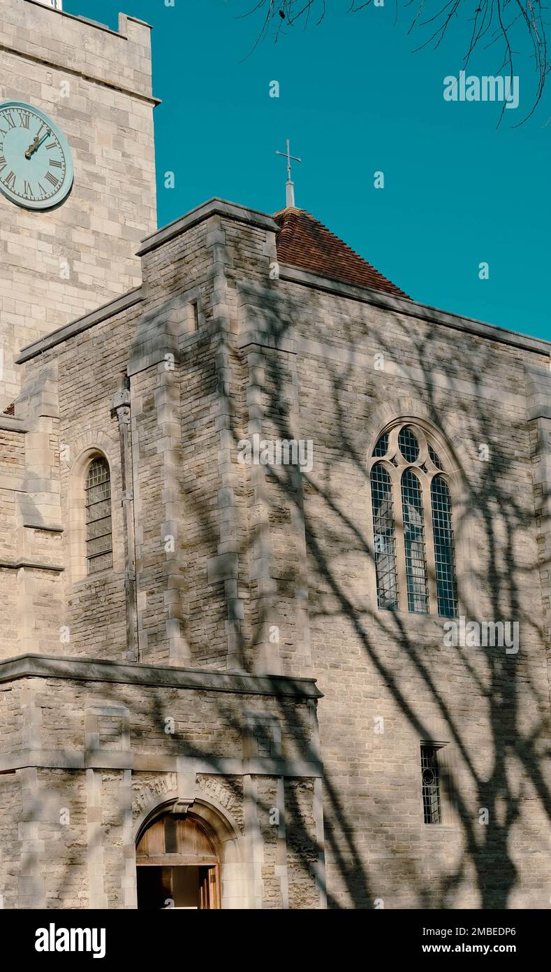 A vertical shot of a church stone facade with tree shadows Stock Photo ...
