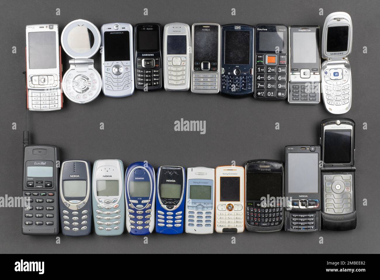 Prague, CZ -  12 December 2021:  A lot of old used mobile phones with keyboards, Various brands. Many types and generations of mobile smartphone gadge Stock Photo